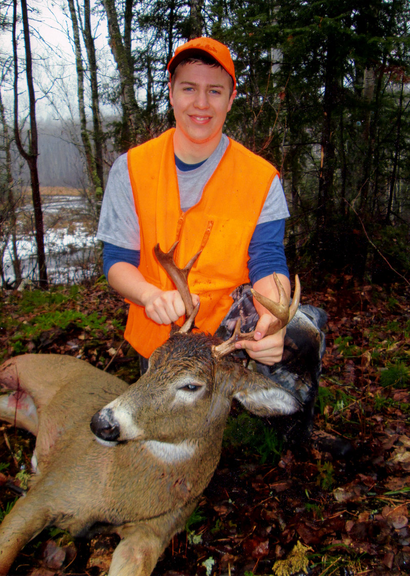 Tyler Nordberg with his last day of the season buck. (2013, 8-pointer)