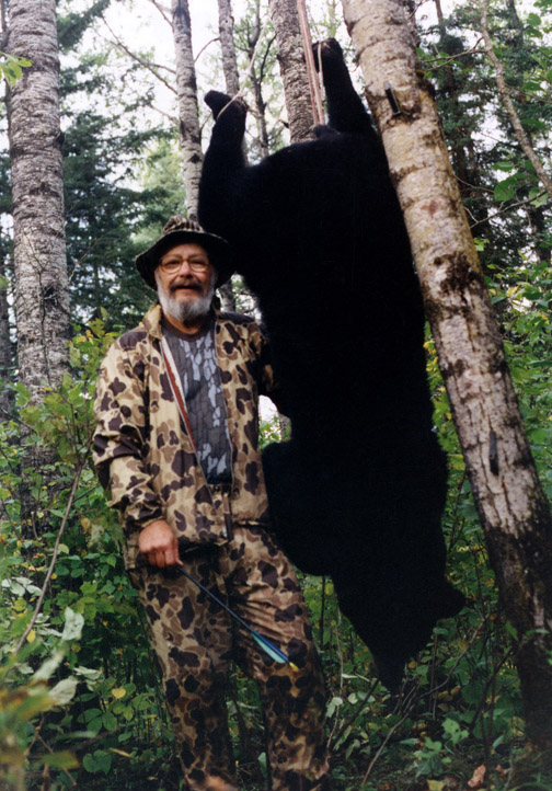 Dr Ken Nordberg with a big black bear